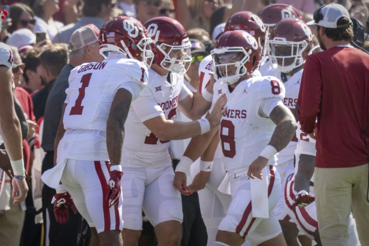 Oct 7, 2023; Dallas, Texas, USA; Oklahoma Sooners wide receiver Jayden Gibson (1) and quarterback Dillon Gabriel (8) celebrates after Gabriel scores a rushing touchdown against the Texas Longhorns during the first half at the Cotton Bowl.