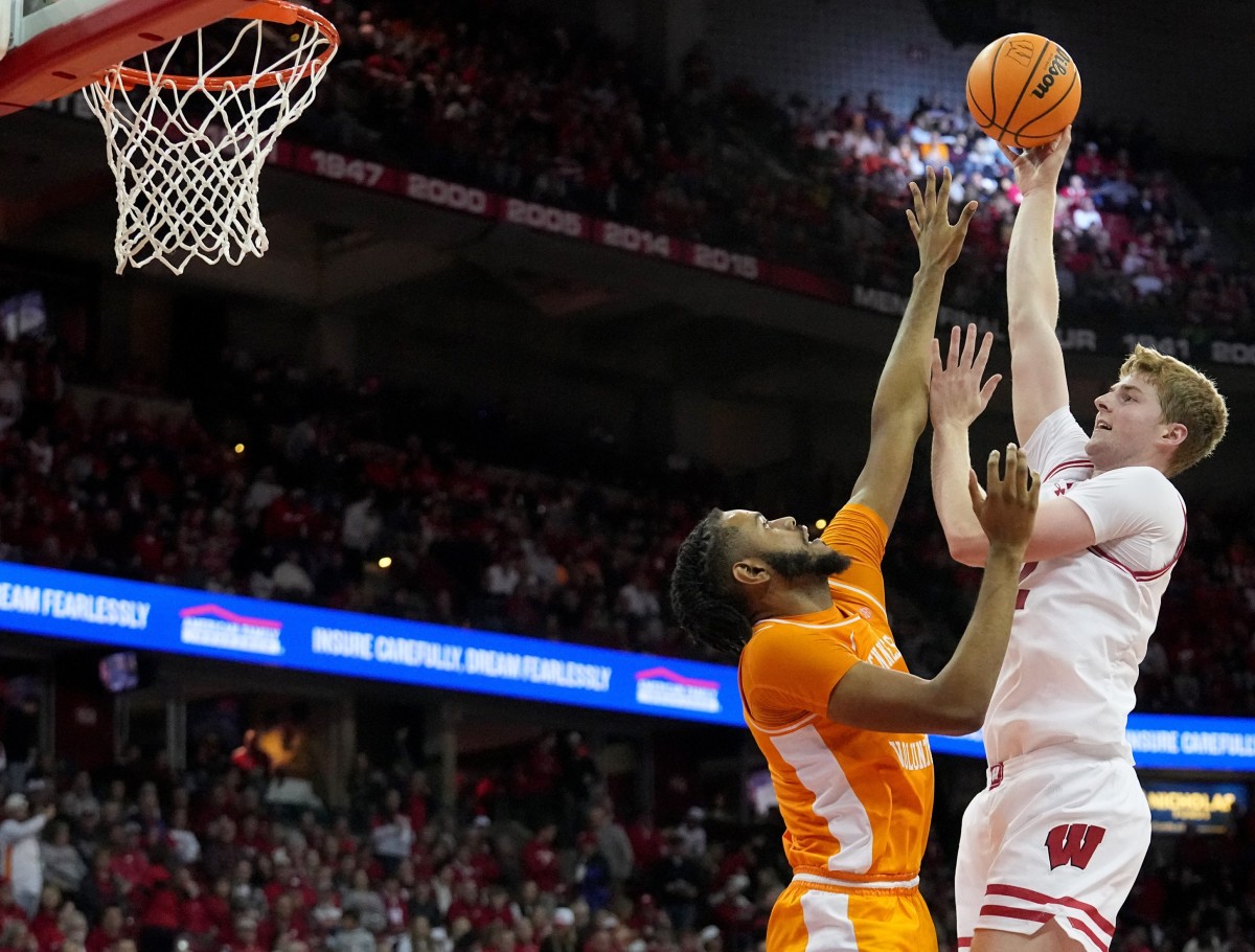 Wisconsin forward Steven Crowl (22) shoots over Tennessee forward Jonas Aidoo (0) during the second half of their game Friday, November 10, 2023 at the Kohl Center in Madison, Wisconsin. Tennessee beat Wisconsin 80-70.