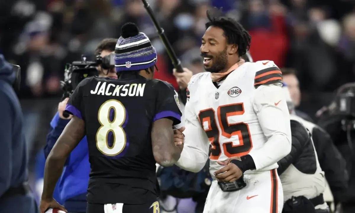 Ravens quarterback Lamar Jackson and Browns defensive end Myles Garrett shake hands after a game.