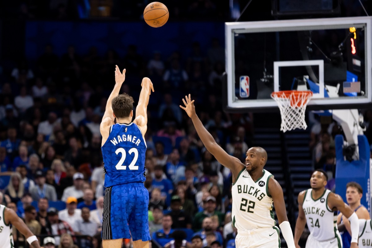 Orlando Magic forward Franz Wagner (22) shoots over Milwaukee Bucks forward Khris Middleton (22) during the second half at Amway Center.