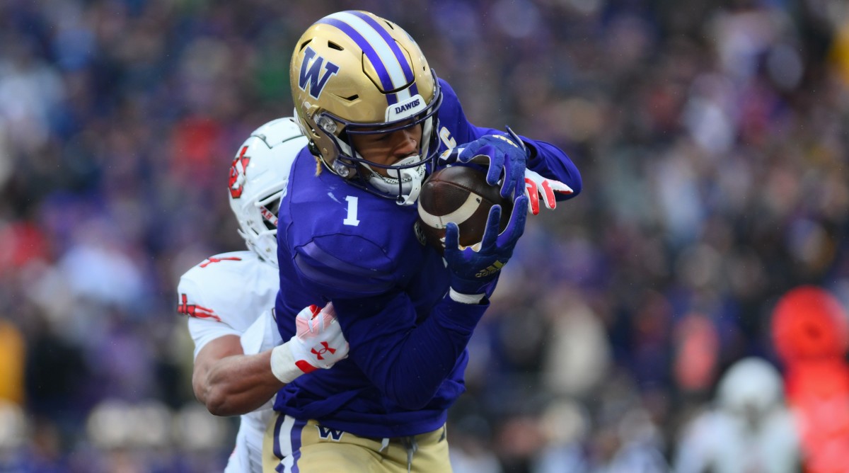 Washington wide receiver Rome Odunze catches a pass during a game against Utah.