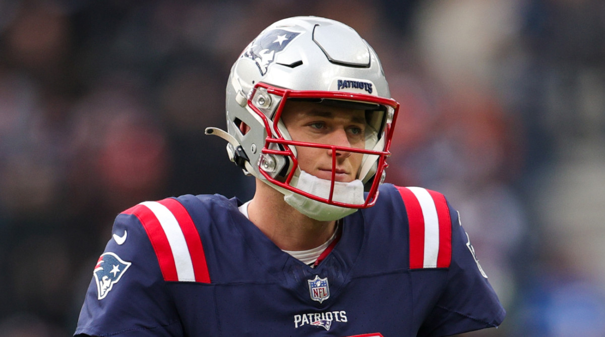 Patriots quarterback Mac Jones warms up before a game.