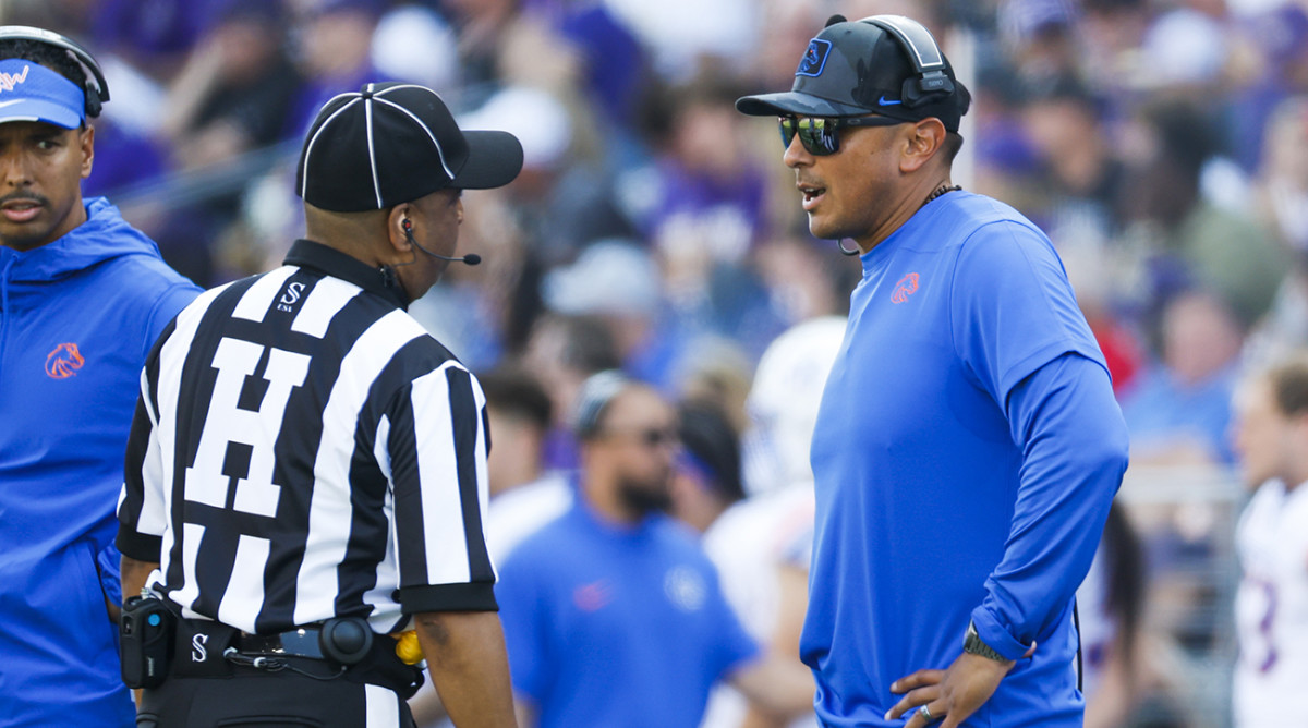 Boise State coach Andy Avalos talks with a referee during a second quarter timeout against Washington at Alaska Airlines Field at Husky Stadium.