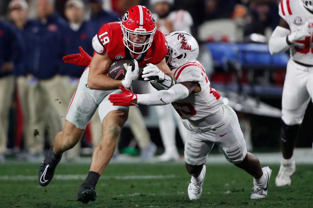 Georgia tight end Brock Bowers competes with Ole Miss safety Trey Washington during the first half of a NCAA college football game against Ole Miss in Athens, Ga., on Saturday, Nov. 11, 2023.