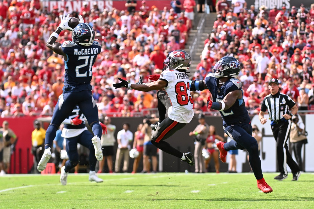Tennessee Titans defensive back Roger McCreary (21) intercepts a pass in the first quarter against the Tampa Bay Buccaneers.