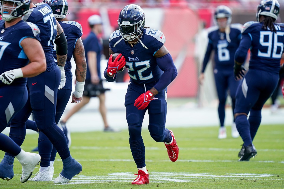 Tennessee Titans running back Derrick Henry (22) runs the ball before a game against the Tampa Bay Buccaneers.