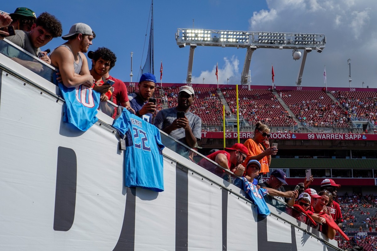 Fans watch warm ups before a game between the Tampa Bay Buccaneers and the Tennessee Titans at Raymond James Stadium.