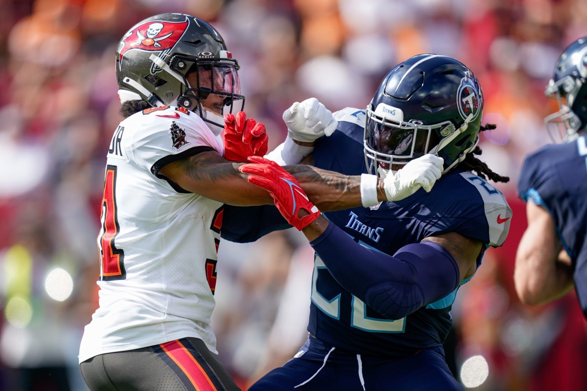 Tampa Bay Buccaneers safety Antoine Winfield Jr. (31) battles Tennessee Titans running back Derrick Henry (22) during the first quarter at Raymond James Stadium.