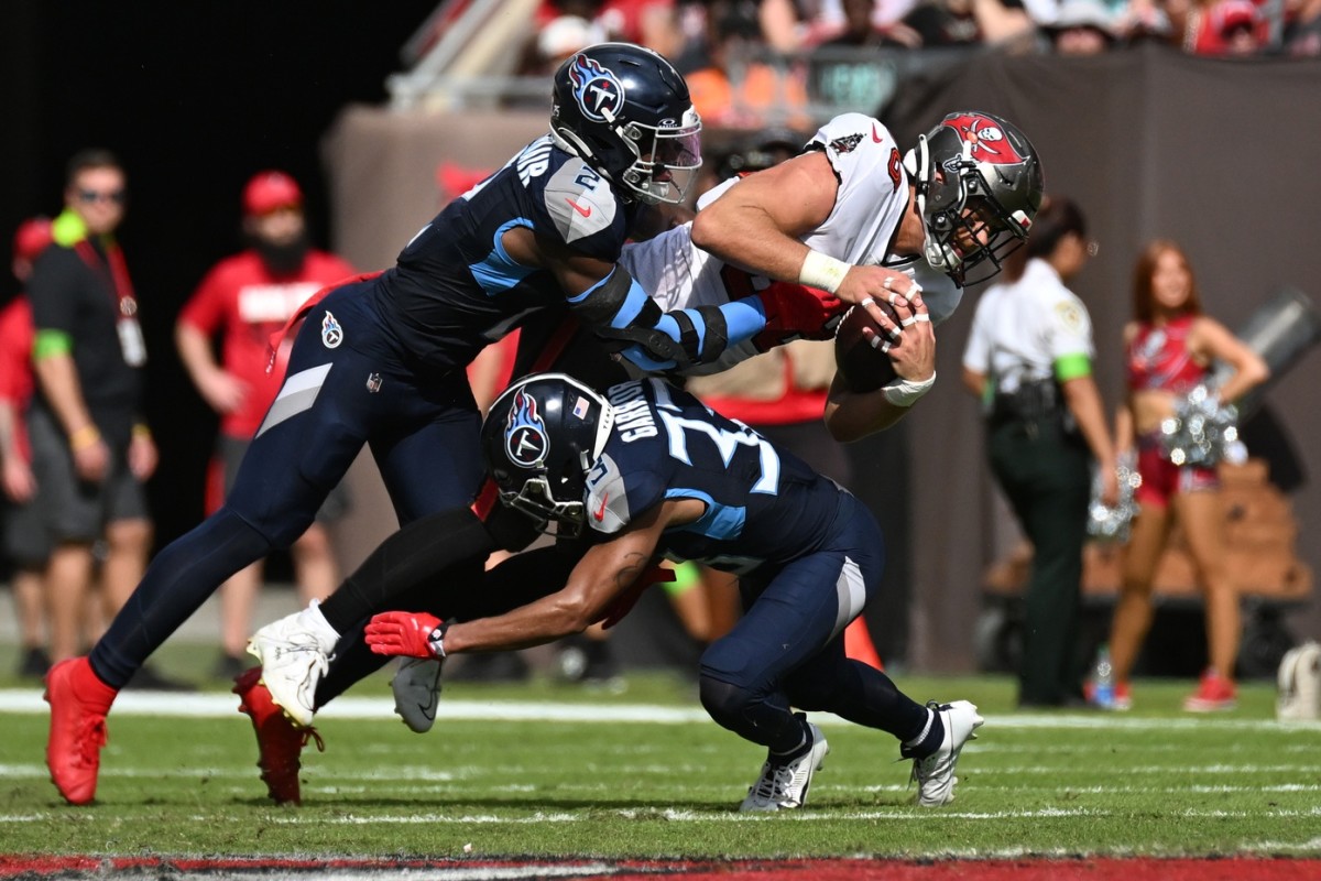  Tampa Bay Buccaneers tight end Cade Otoon (88) gets tackled by Tennessee Titans linebacker Azeez Al-Shaair (2) and Tennessee Titans defensive back Eric Garner (33).