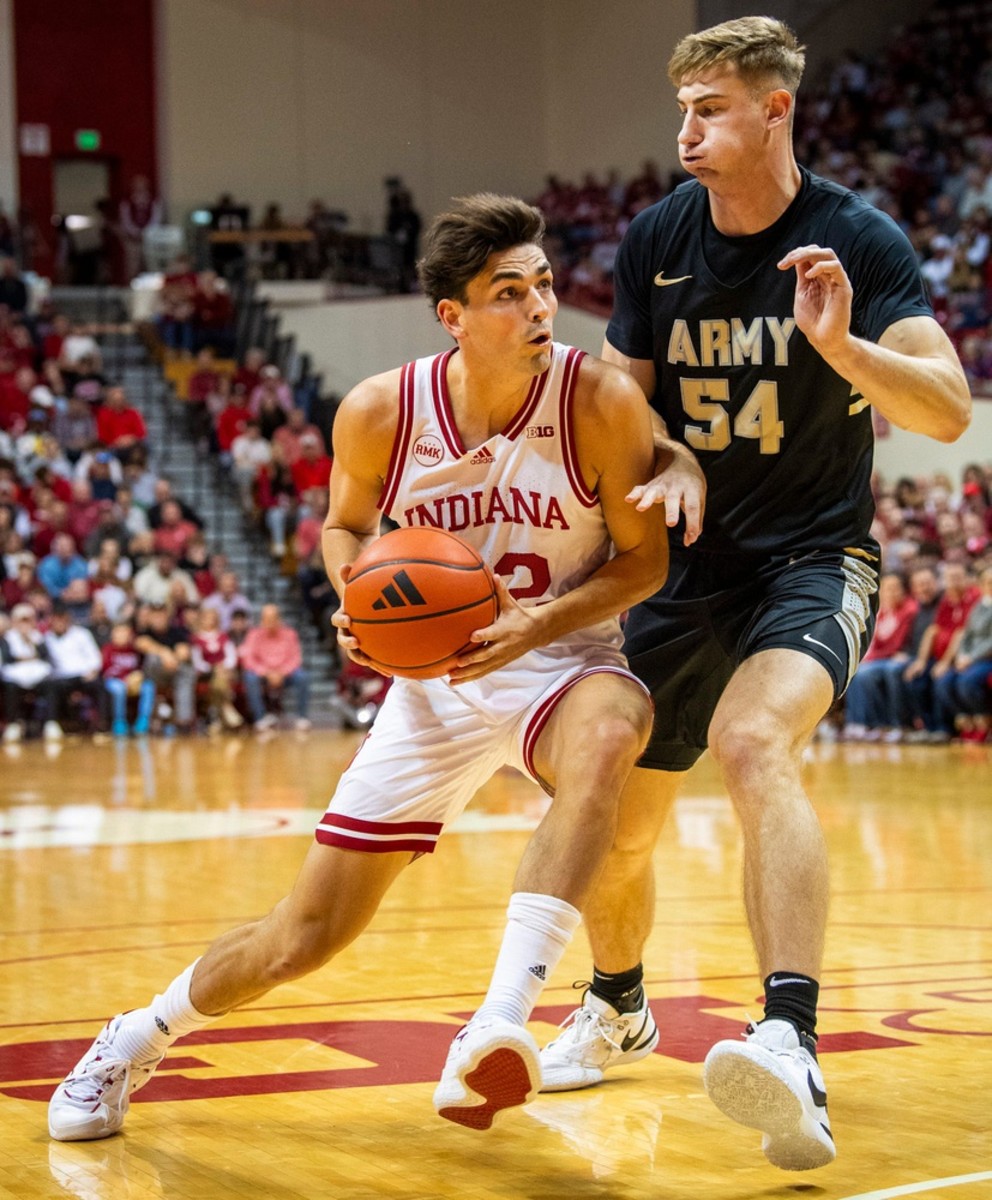 Indiana's Trey Galloway (32) drives on Army's Abe Johnson (54) during the first half of the Indiana versus Army men's basketball game at Simon Skjodt Assembly Hall.