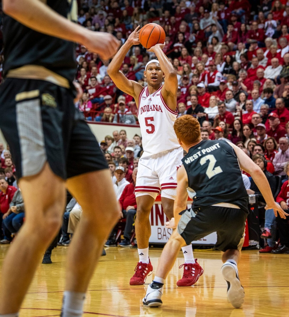 Indiana's Malik Reneau (5) shoots over Army's Ryan Curry (2) during the first half of the Indiana versus Army men's basketball game.