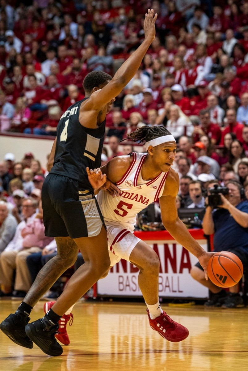 Indiana's Malik Reneau (5) drives on Army's Josh Scovens (4) during the first half of the Indiana versus Army men's basketball game.