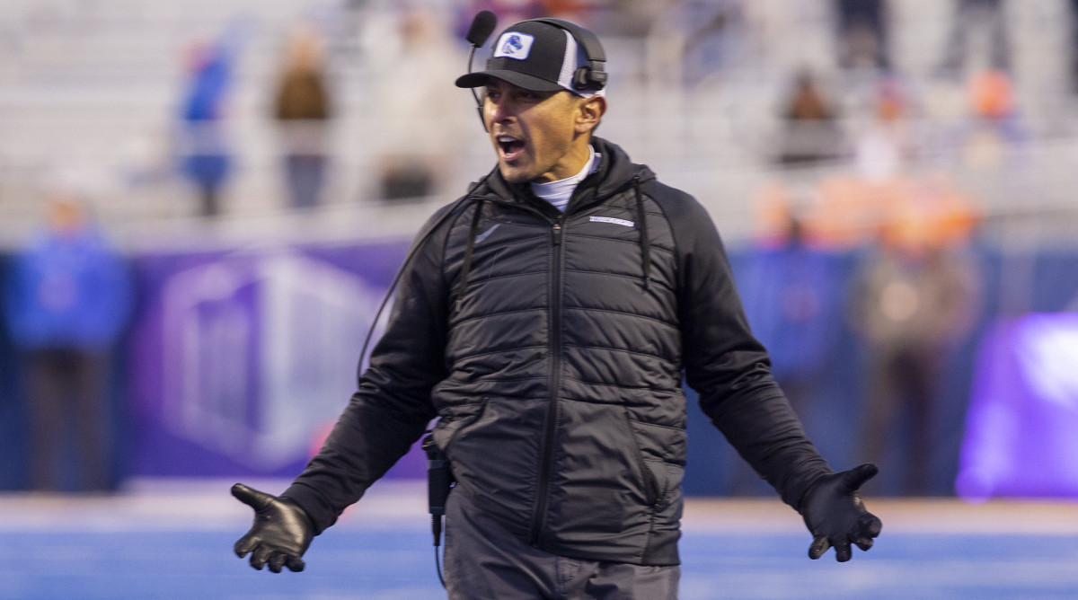 Boise State coach Andy Avalos reacts with his arms outstretched