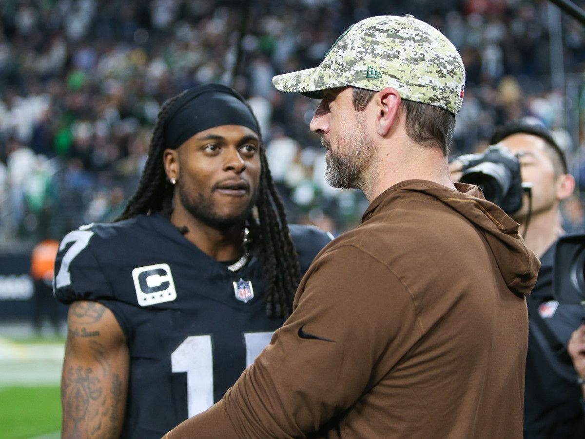 Las Vegas Raiders WR Davante Adams speaking to his former QB, and terrific friend Aaron Rodgers at Allegiant Stadium on Sunday Night.