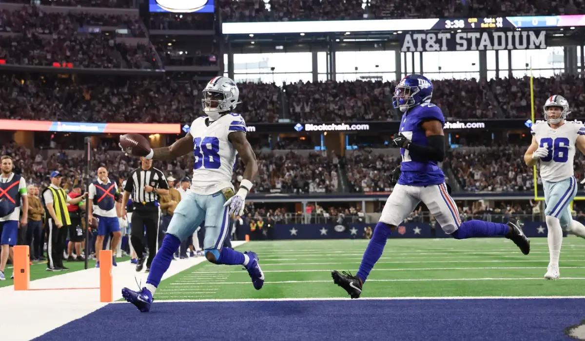 Cowboys receiver CeeDee Lamb scampers into the end zone during Sunday's game.