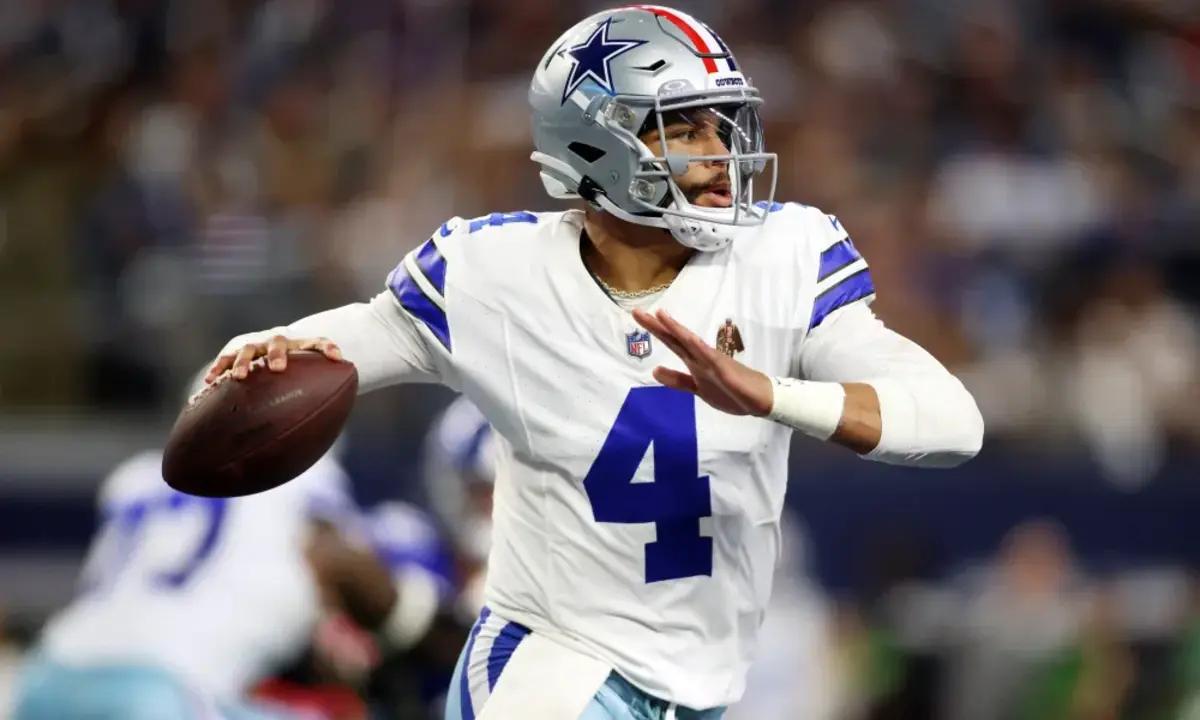 Cowboys QB Dak Prescott delivering a pass during a Dallas home game.