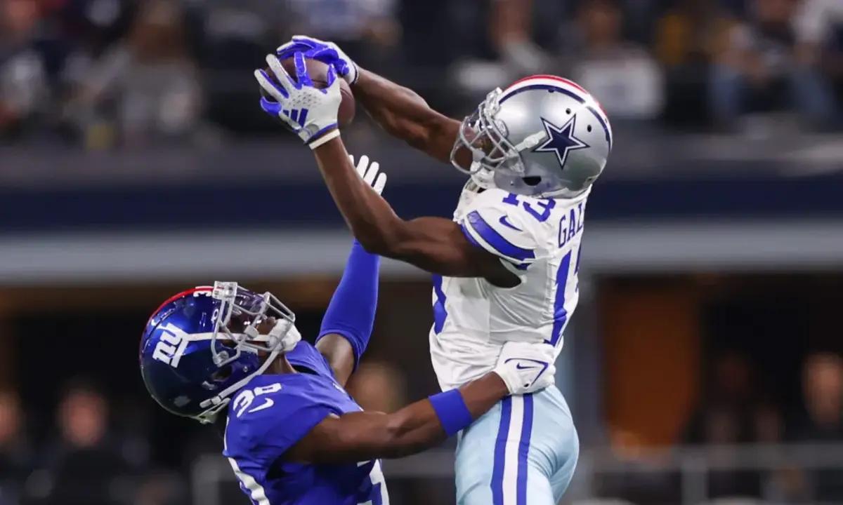 Nov 12, 2023; Arlington, Texas, USA; Dallas Cowboys wide receiver Michael Gallup (13) makes a catch over New York Giants cornerback Darnay Holmes (30) during the second half at AT&T Stadium