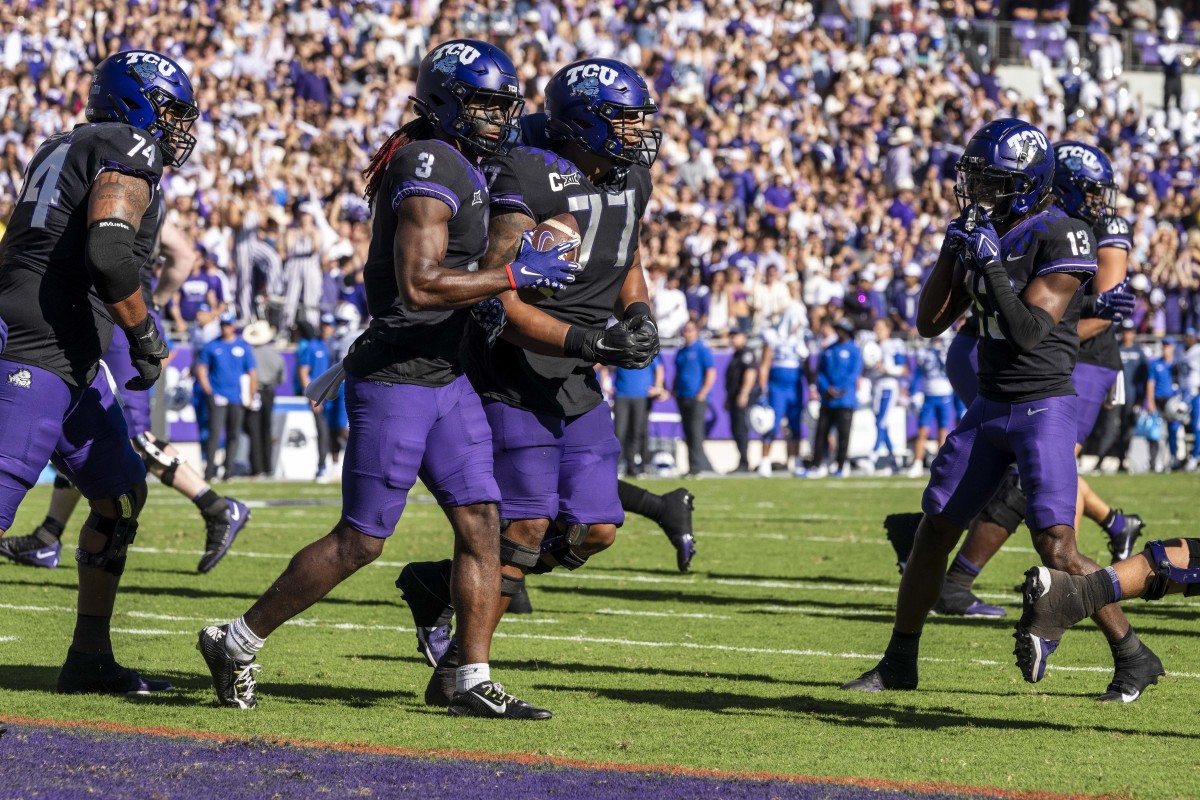 Oct 14, 2023; Fort Worth, Texas, USA; TCU Horned Frogs wide receiver Savion Williams (3) and offensive lineman Andrew Coker (74) and offensive lineman Brandon Coleman (77) and wide receiver Jaylon Robinson (13) celebrates after Williams scores a touchdown against the Brigham Young Cougars during the game at Amon G. Carter Stadium. Mandatory Credit: Jerome Miron-USA TODAY Sports