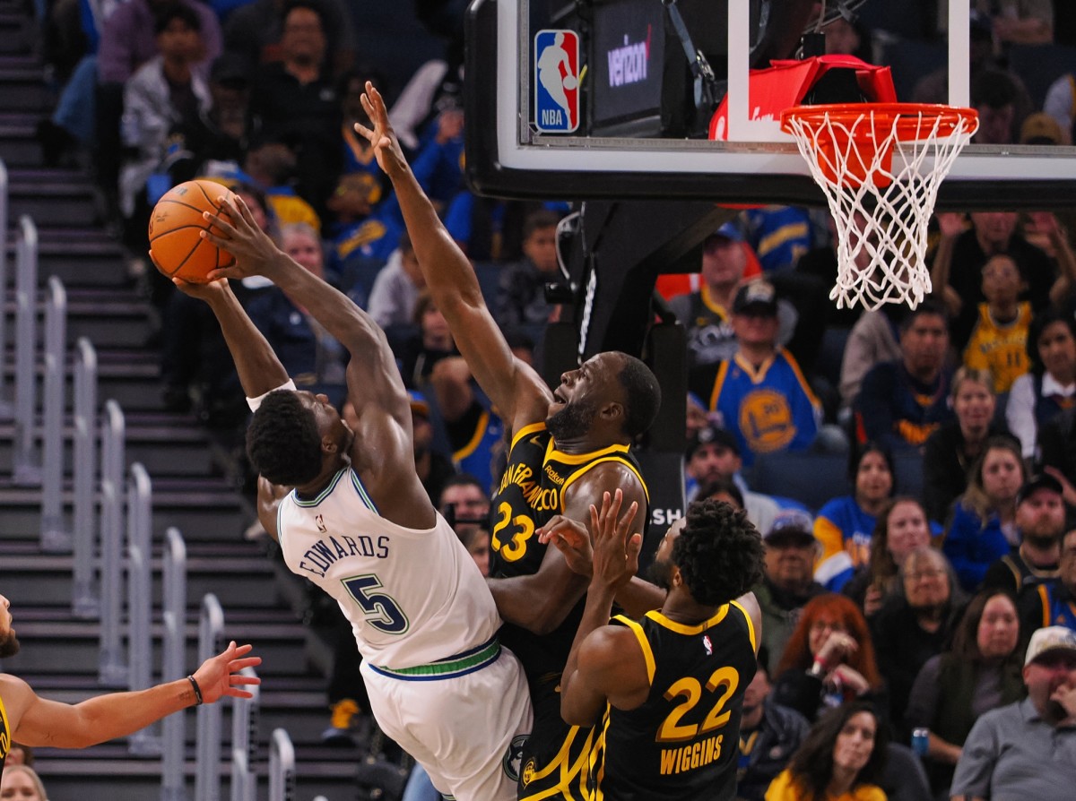 Nov 12, 2023; San Francisco, California, USA; Minnesota Timberwolves guard Anthony Edwards (5) shoots the ball agsint Golden State Warriors forward Draymond Green (23) during the fourth quarter at Chase Center. 