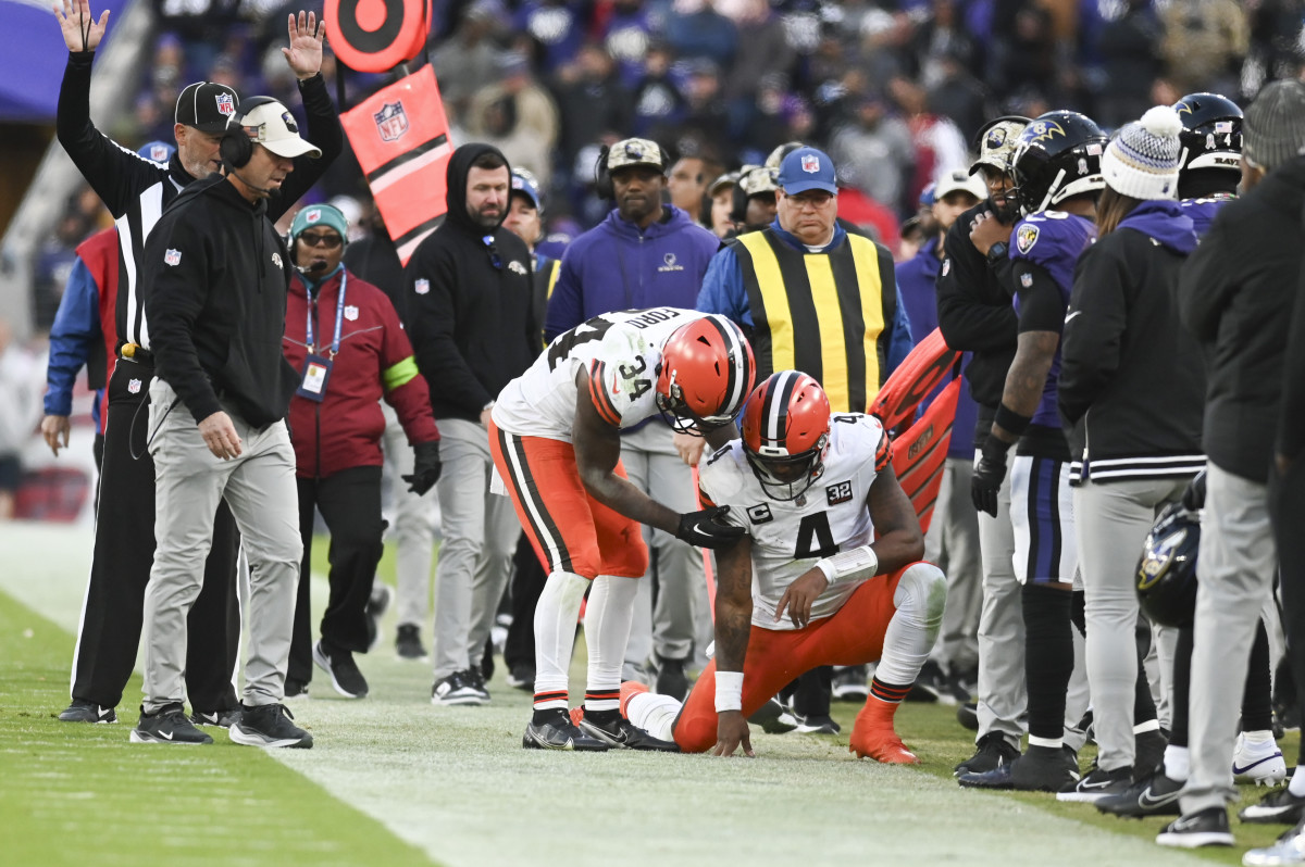 Nov 12, 2023; Baltimore, Maryland, USA; Cleveland Browns quarterback Deshaun Watson (4) is helped up by running back Jerome Ford (34) after being tackled out of bounds during the second half against the Baltimore Ravens at M&T Bank Stadium.