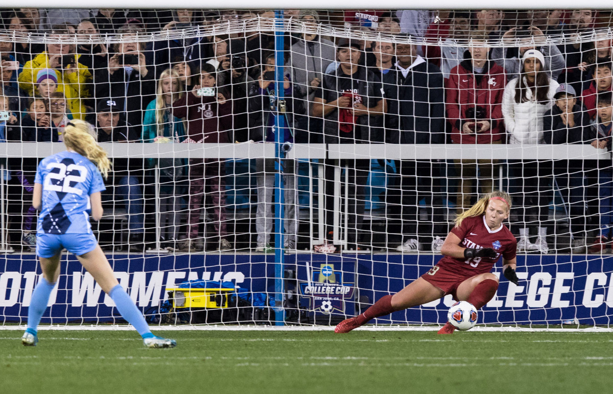 Playing goalie, Katie dives for a ball kicked in a shootout by a UNC player.