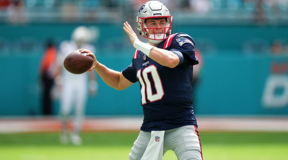 Patriots quarterback Mac Jones throws a pass in warmups before a game vs. the Dolphins.