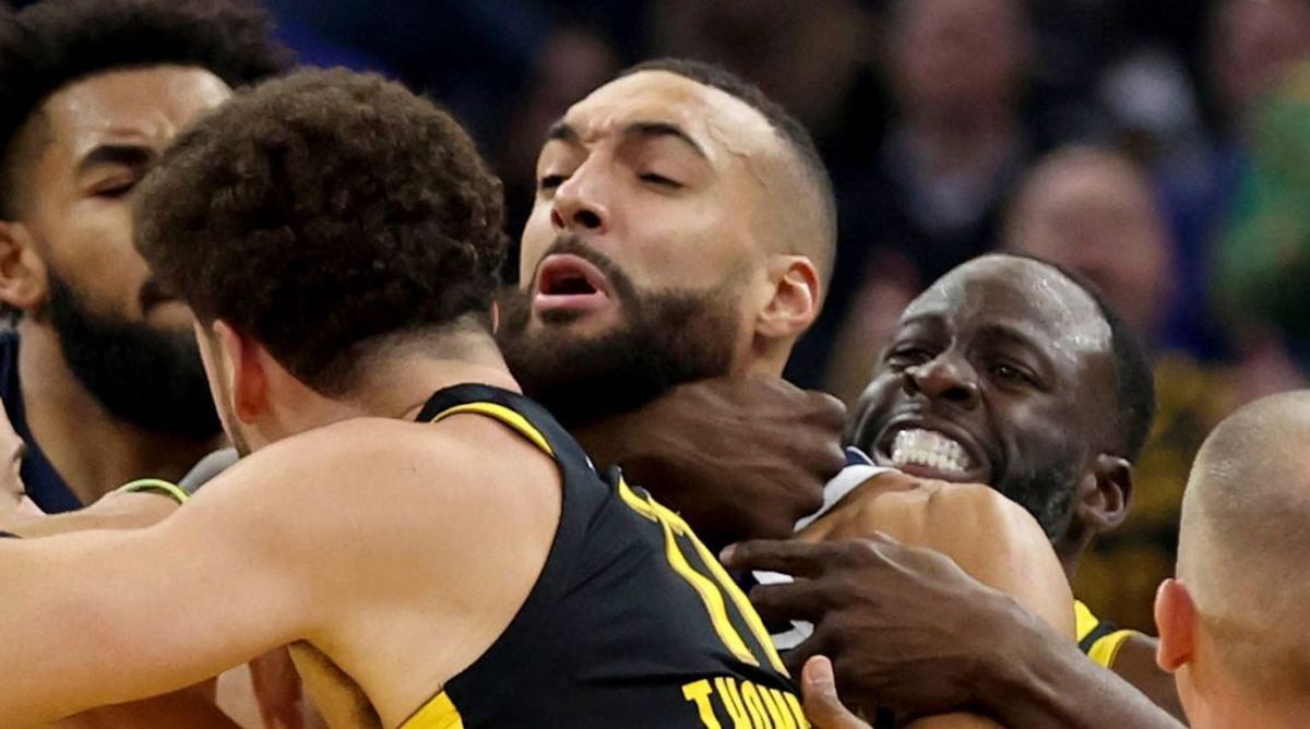 Golden State Warriors' Klay Thompson, front, and Draymond Green, back, get into an altercation with Minnesota Timberwolves center Rudy Gobert, middle, during the first half of an in-season NBA tournament basketball game in San Francisco, Tuesday, Nov. 14, 2023. All three were ejected. (AP Photo/Jed Jacobsohn)