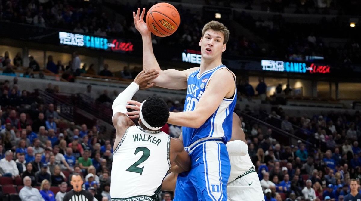 Duke center Kyle Filipowski is defended closely during a game against Michigan State.