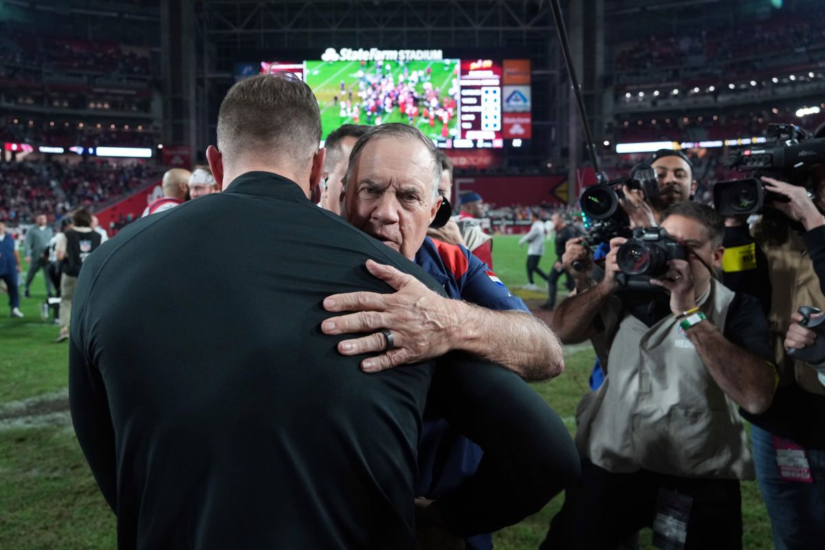 Arizona Cardinals head coach Kliff Kingsbury and New England Patriots head coach Bill Belichick hug after their game at State Farm Stadium.