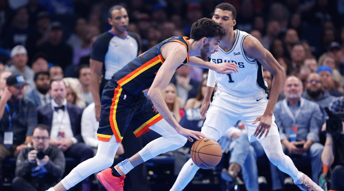 Oklahoma City Thunder forward Chet Holmgren drives past San Antonio Spurs center Victor Wembanyama.
