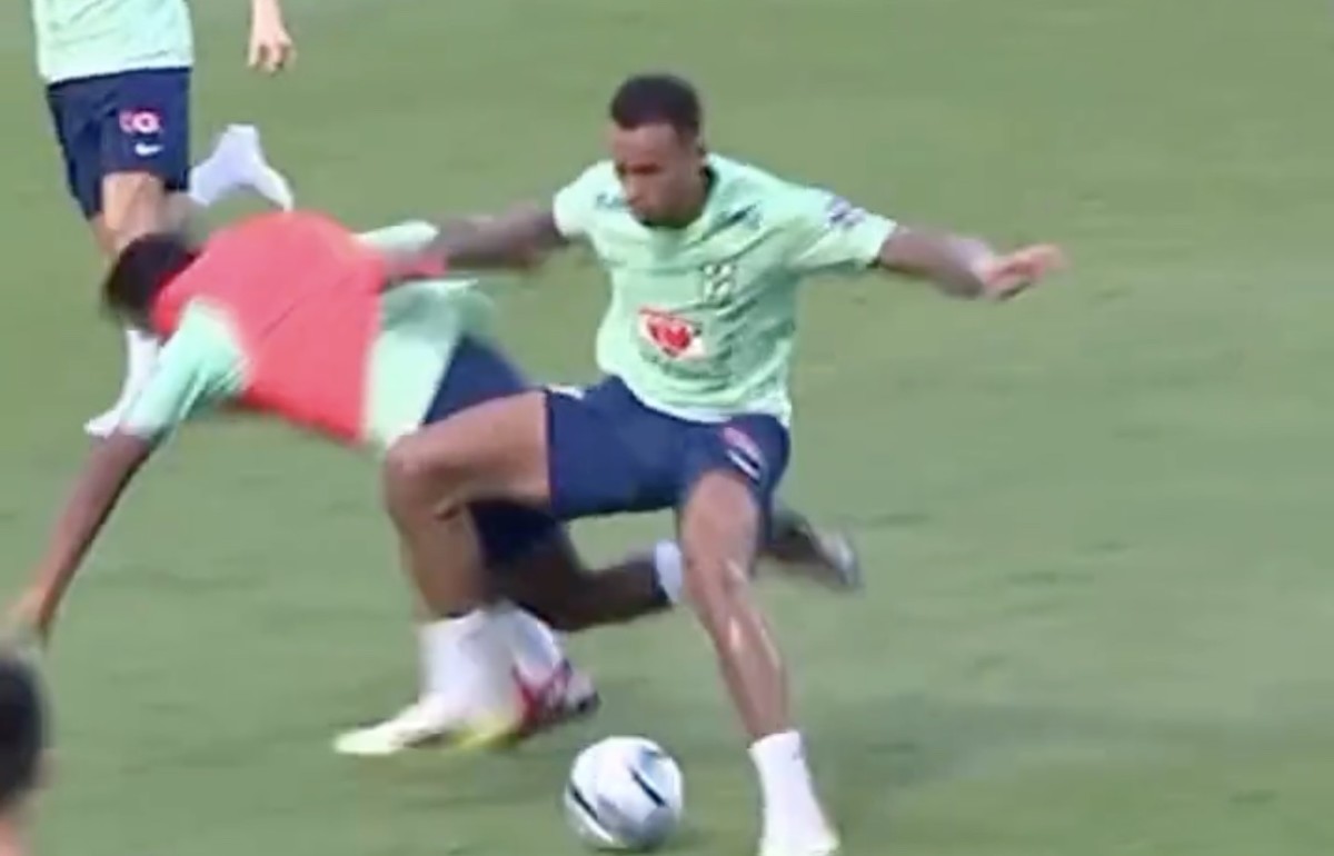 Endrick pictured falling to the ground following a strong tackle by defender Gabriel during a Brazil training session in November 2023