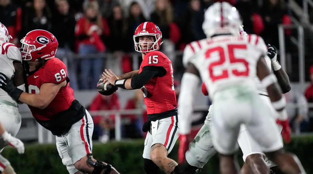 Georgia quarterback Carson Beck (15) throws from the pocket during the first half of a game against Ole Miss.