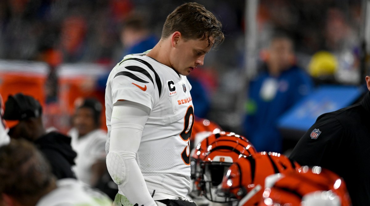 Bengals quarterback Joe Burrow looks with his head down during a game against the Ravens.