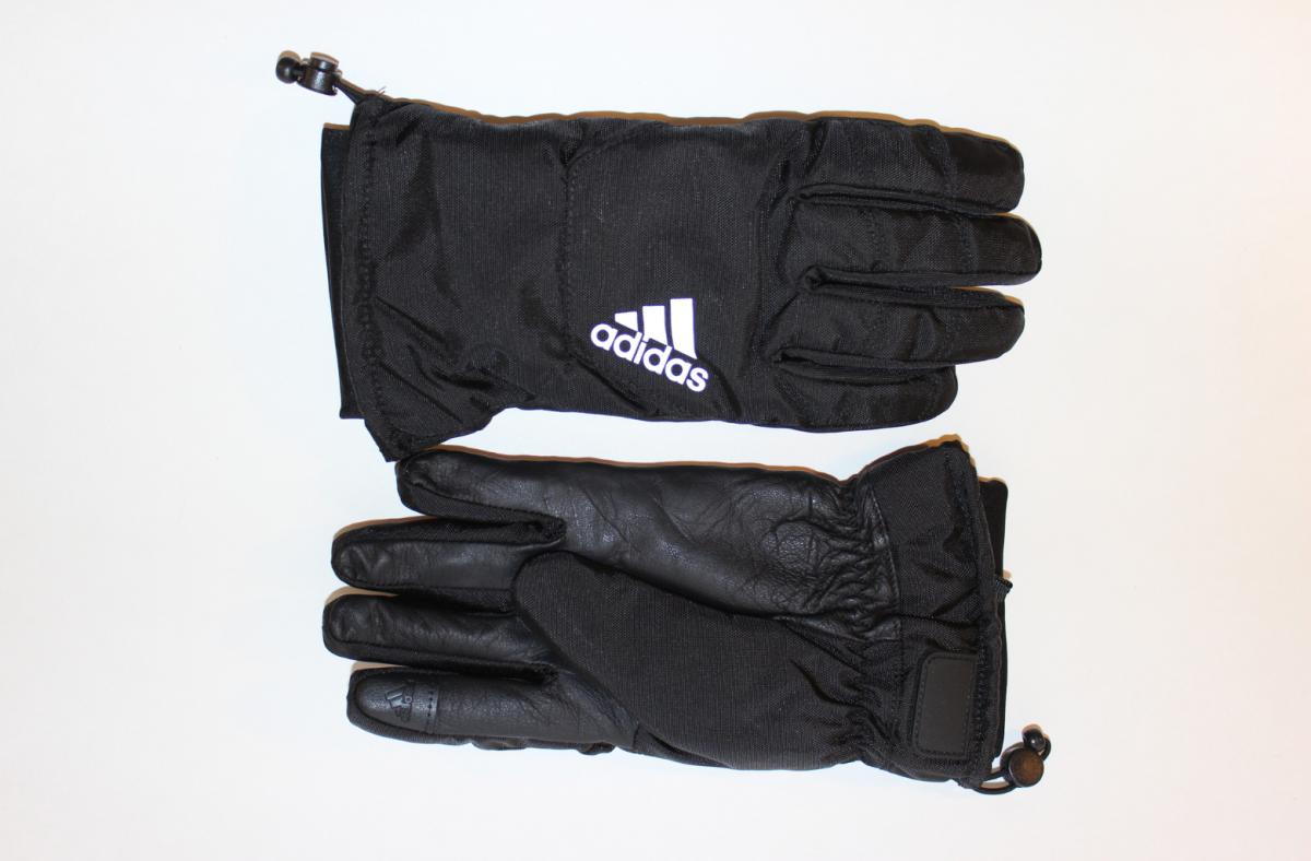 A recently worn pair of adidas Teber gloves against a white background