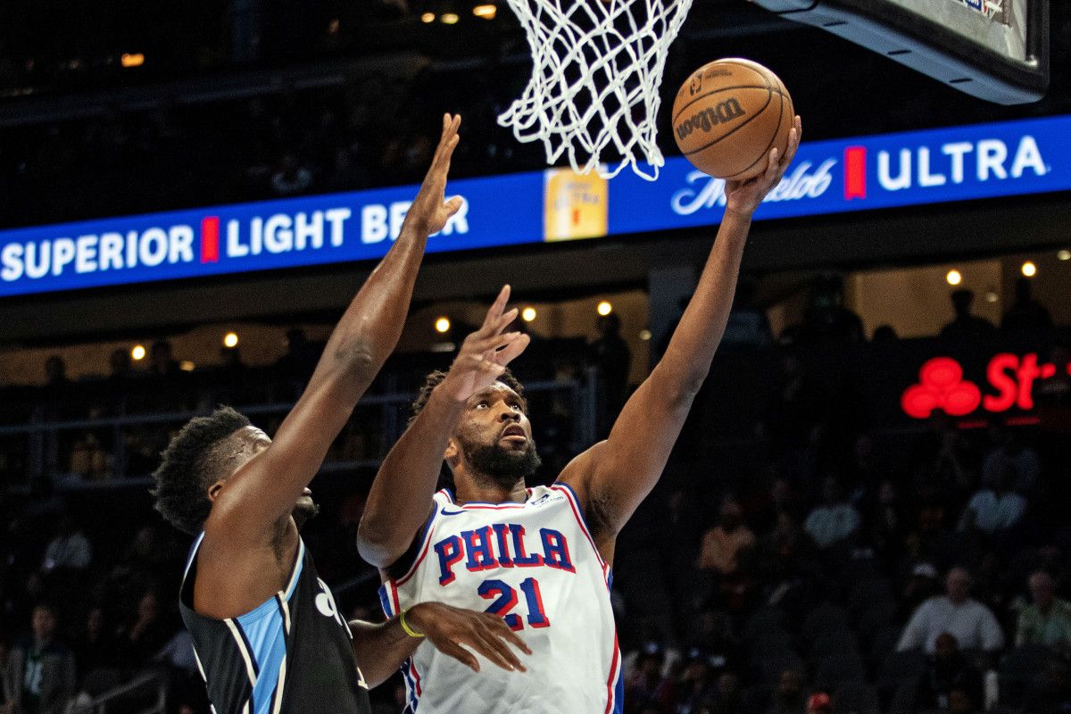 Joel Embiid goes for a layup against Clint Capela