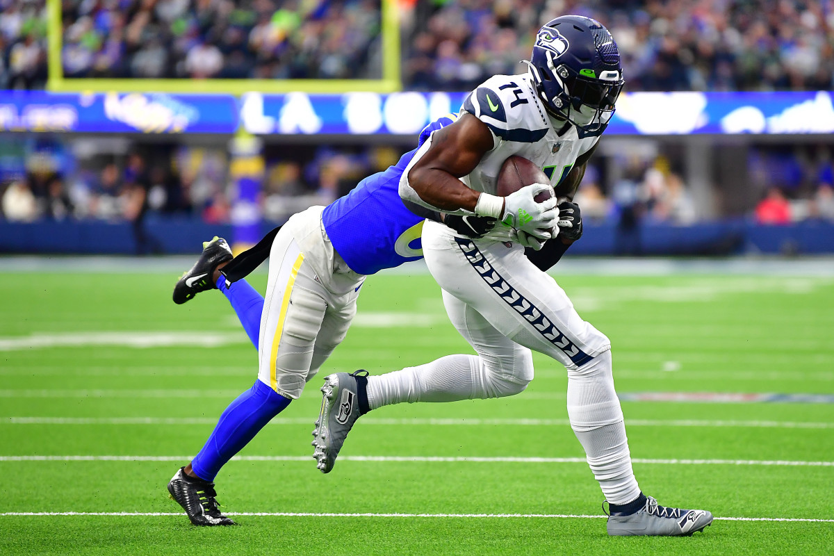 Seattle Seahawks wide receiver DK Metcalf (14) runs the ball against Los Angeles Rams cornerback Derion Kendrick (6) during the second half at SoFi Stadium. 