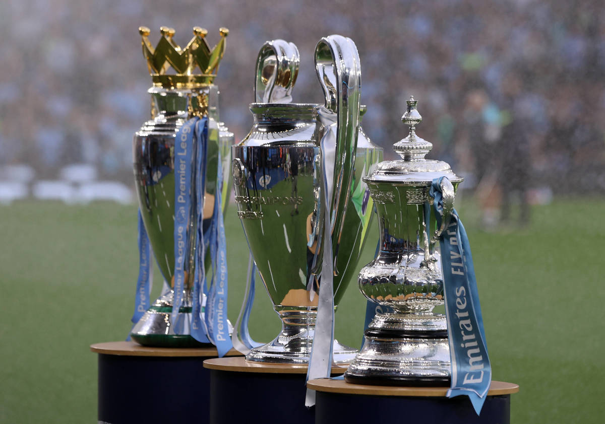 Manchester City's Premier League, Champions League and FA Cup trophies pictured on display ahead of the team's first home game of the 2023/24 season