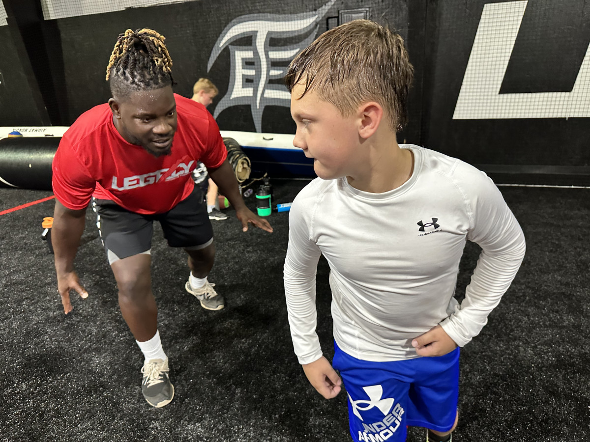 Sean Weatherspoon working with a student at Legacy Sports Complex.