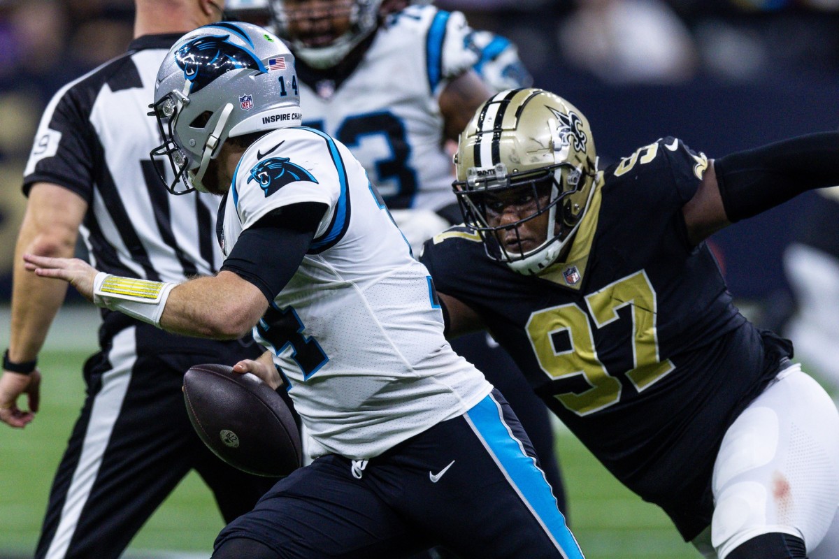 Carolina Panthers quarterback Sam Darnold (14) is pressured by New Orleans Saints defensive tackle Malcolm Roach (97). Mandatory Credit: Stephen Lew-USA TODAY Sports
