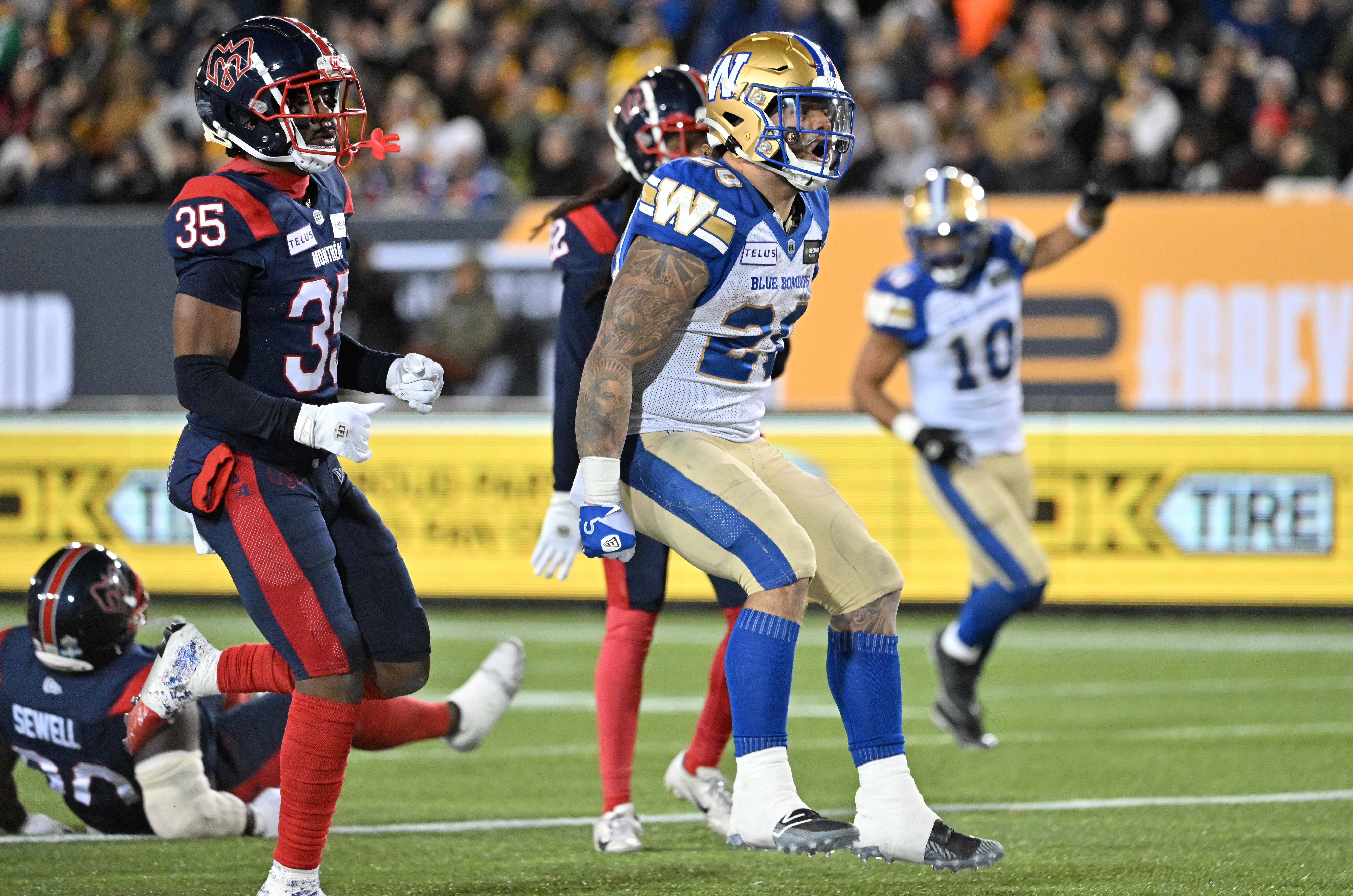 Nov 19, 2023; Hamilton, Ontario, CAN; Winnipeg Blue Bombers running back Brady Oliveira (20) celebrates after scoring a touchdown past Montreal Alouettes defensive back Reggie Stubblefield (35) in the first half at Tim Hortons Field. Mandatory Credit: Dan Hamilton-USA TODAY Sports