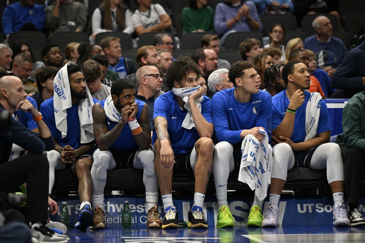 The Dallas Mavericks bench looks on en route to a 129-113 loss to the Sacramento Kings on Sunday night.
