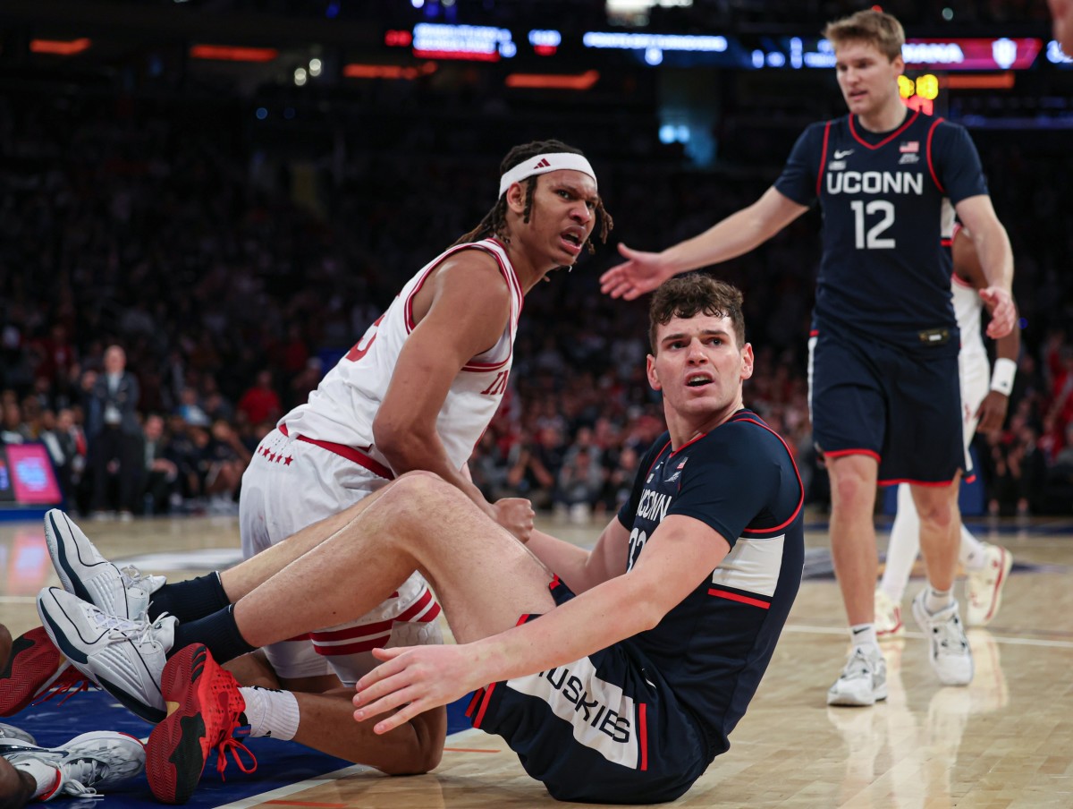 Connecticut Huskies center Donovan Clingan (32) and Indiana Hoosiers forward Malik Reneau (5) react after a play during the second half at Madison Square Garden. 