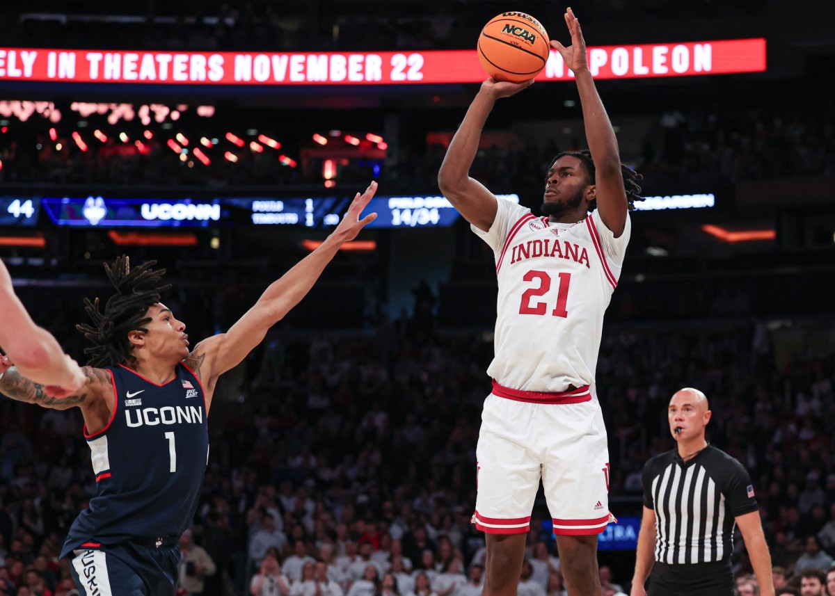 Indiana Hoosiers forward Mackenzie Mgbako (21) shoots as Connecticut Huskies guard Solomon Ball (1) defends during the second half at Madison Square Garden.