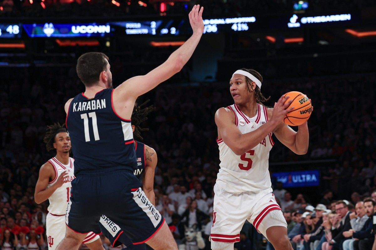 Indiana Hoosiers forward Malik Reneau (5) looks to pass as Connecticut Huskies forward Alex Karaban (11) defends during the second half at Madison Square Garden.