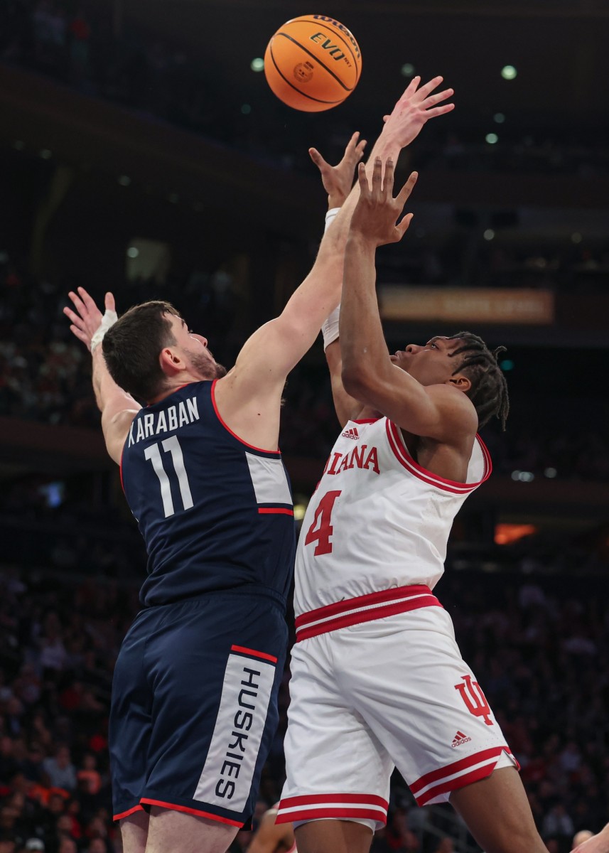 Connecticut Huskies forward Alex Karaban (11) battles Indiana Hoosiers forward Anthony Walker (4) for a rebound during the second half at Madison Square Garden.