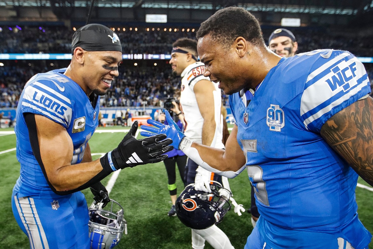 Amon Ra-St. Brown and David Montgomery celebrate the Lions' come from behind win against the Bears in Week 11.