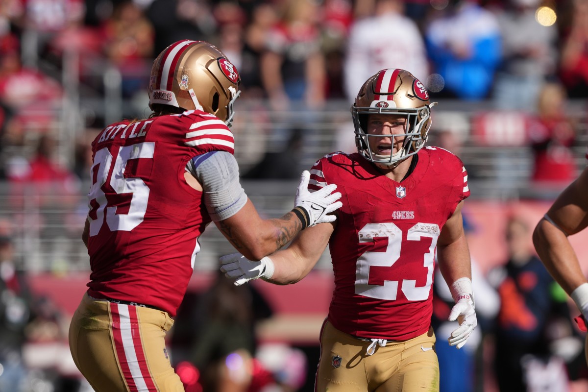 49ers tight end George Kittle congratulates running back Christian McCaffrey after he scored a touchdown in San Francisco's win over Tampa Bay in Week 11.