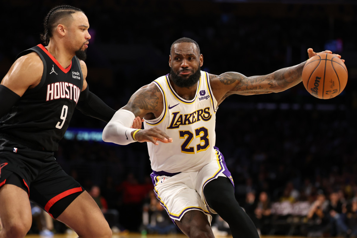 Los Angeles Lakers forward LeBron James dribbles past Houston Rockets forward Dillon Brooks during the second quarter at Crypto.com Arena.