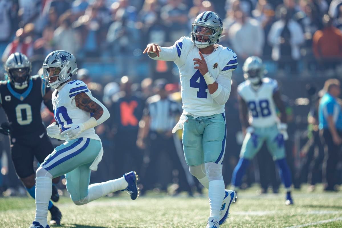 Dallas Cowboys quarterback Dak Prescott throws a pass during the first quarter against the Carolina Panthers at Bank of America Stadium.