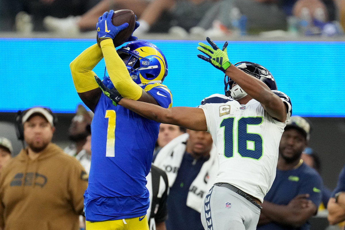 Los Angeles Rams cornerback Derion Kendrick (1) makes a catch against Seattle Seahawks wide receiver Tyler Lockett (16) in the fourth quarter at SoFi Stadium.